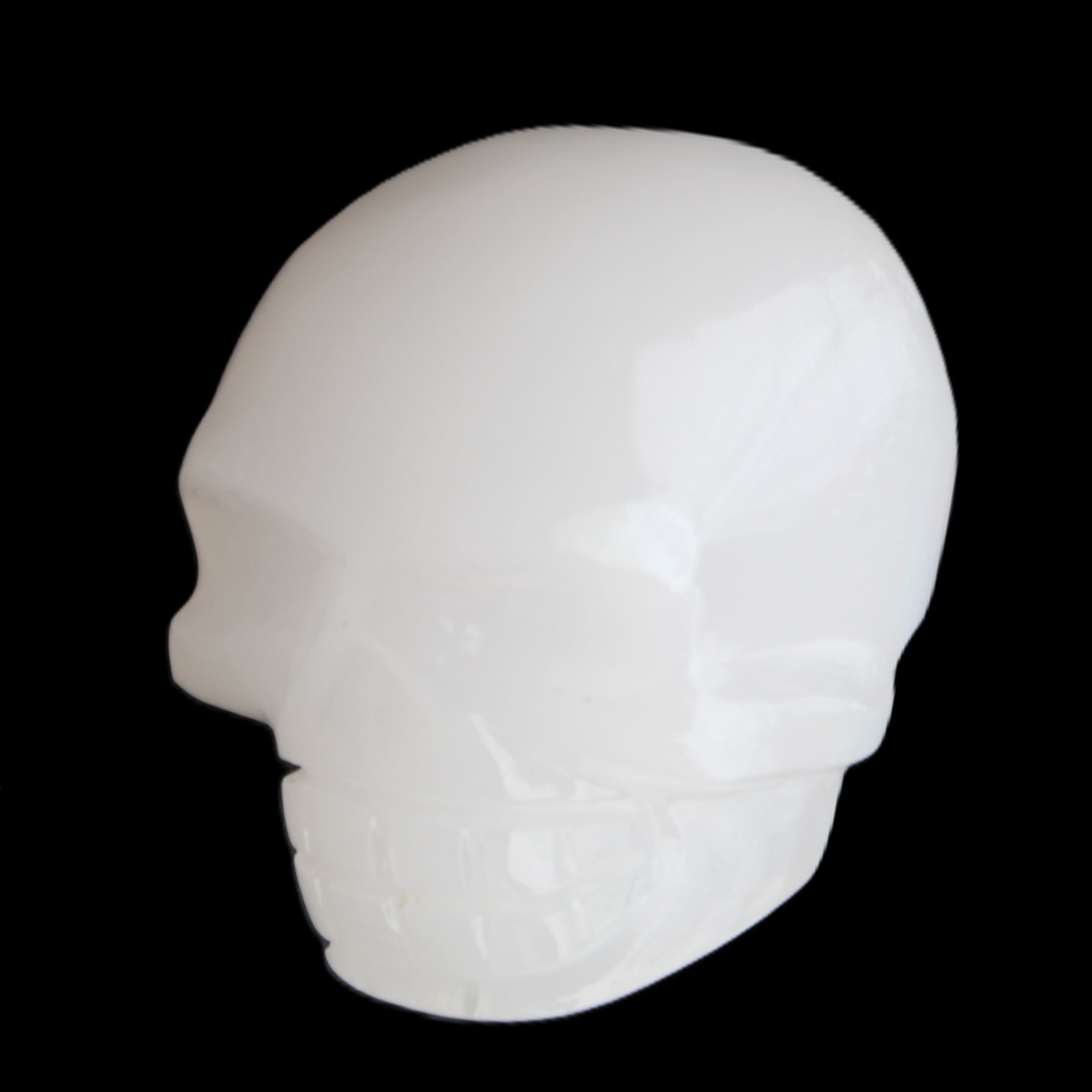 Mangano Calcite skull 45*52*48mm 196g in sunlight - Rocks and Things Store