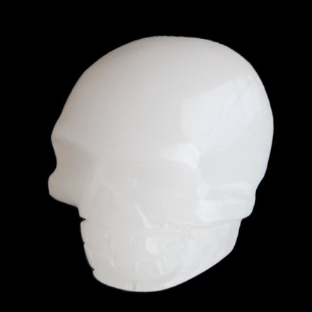 Mangano Calcite skull 45*52*48mm 196g in sunlight - Rocks and Things Store