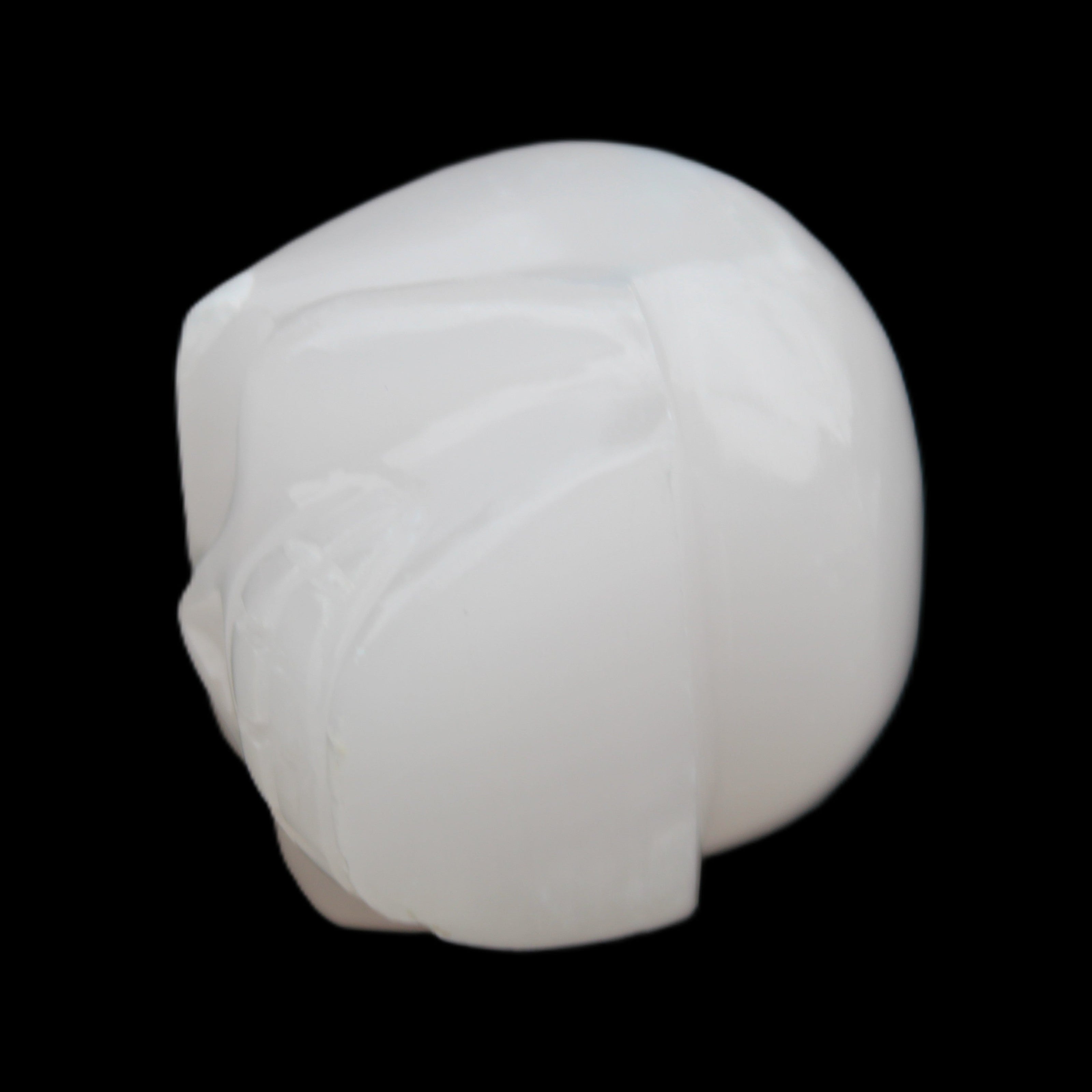 Mangano Calcite skull 45*52*48mm 196g in sunlight - Rocks and Things Store