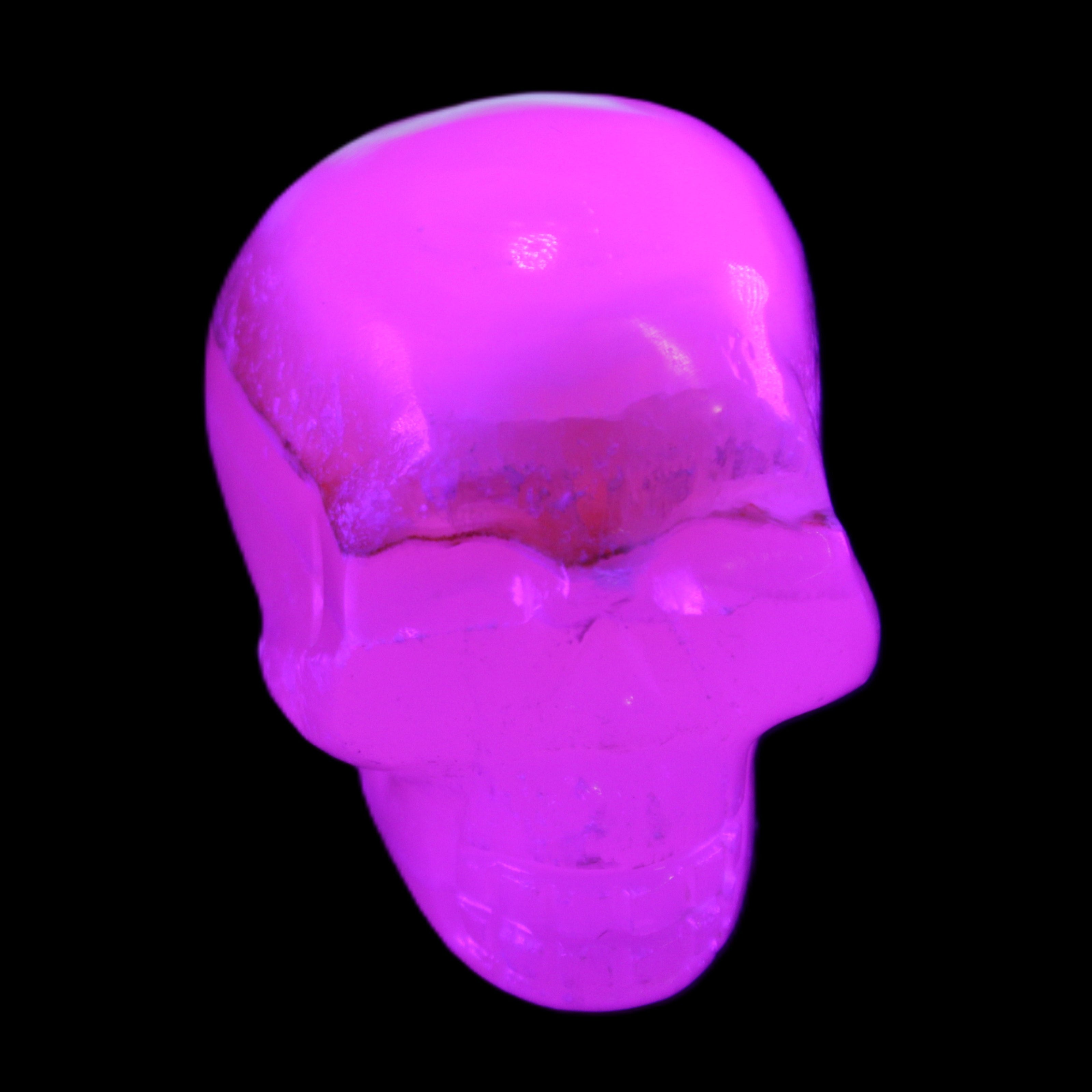 Mangano Calcite skull 38*55*48mm 167g in UV light - Rocks and Things Store