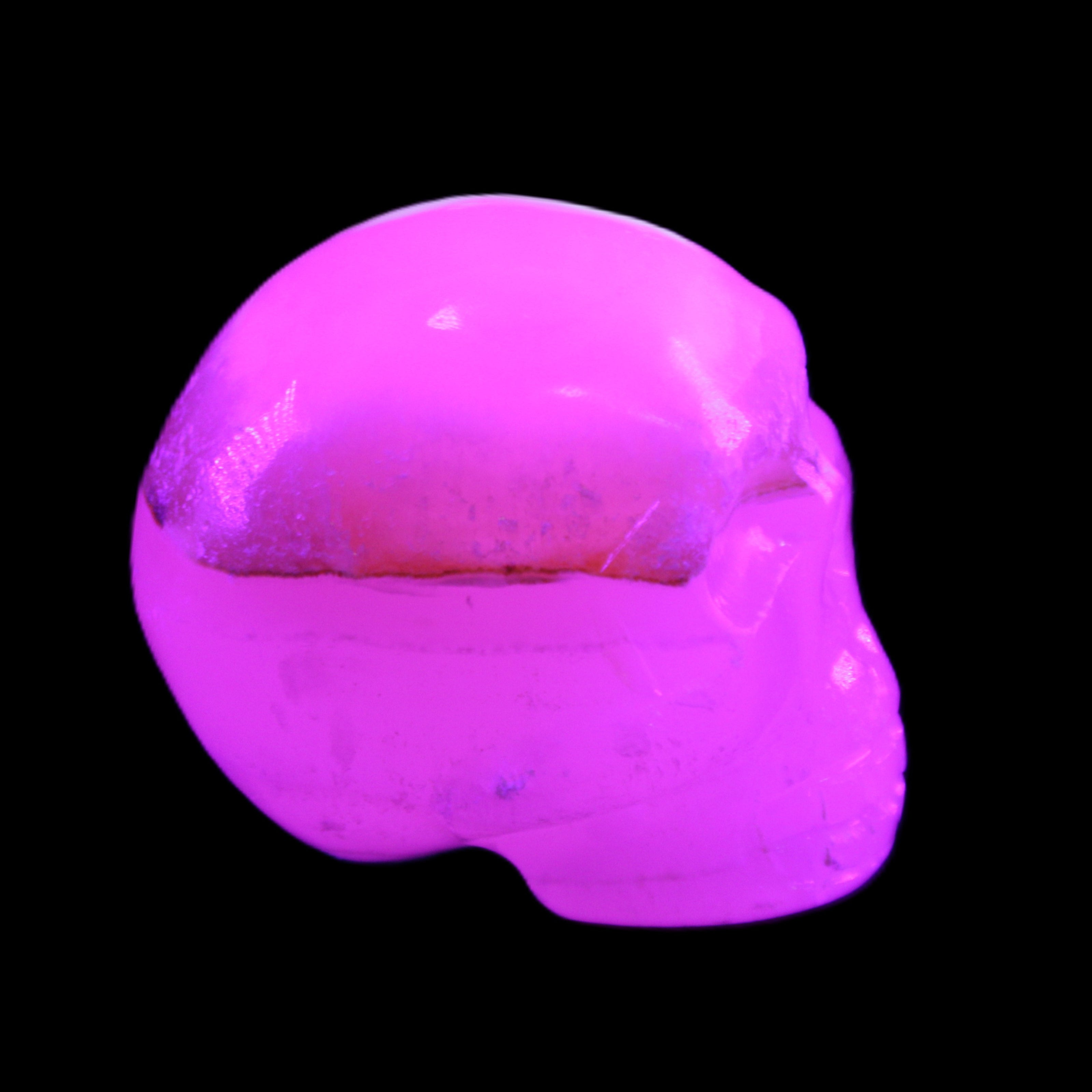 Mangano Calcite skull 38*55*48mm 167g in UV light - Rocks and Things Store
