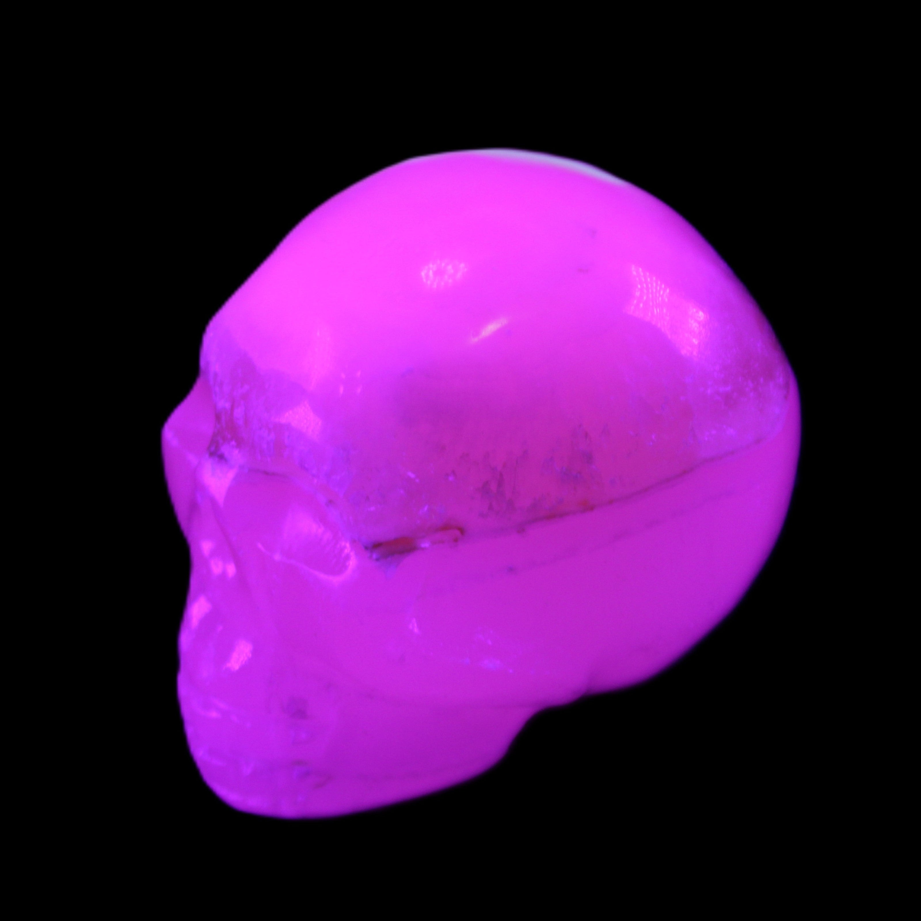 Mangano Calcite skull 38*55*48mm 167g in sunlight - Rocks and Things Store