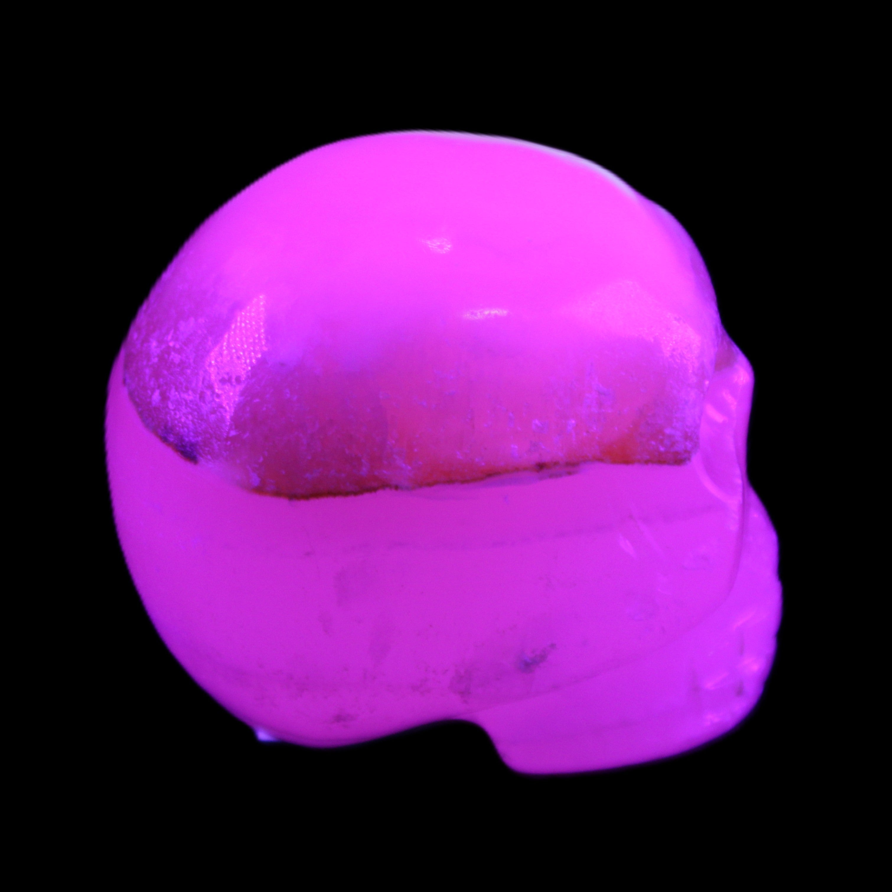 Mangano Calcite skull 38*55*48mm 167g in sunlight - Rocks and Things Store