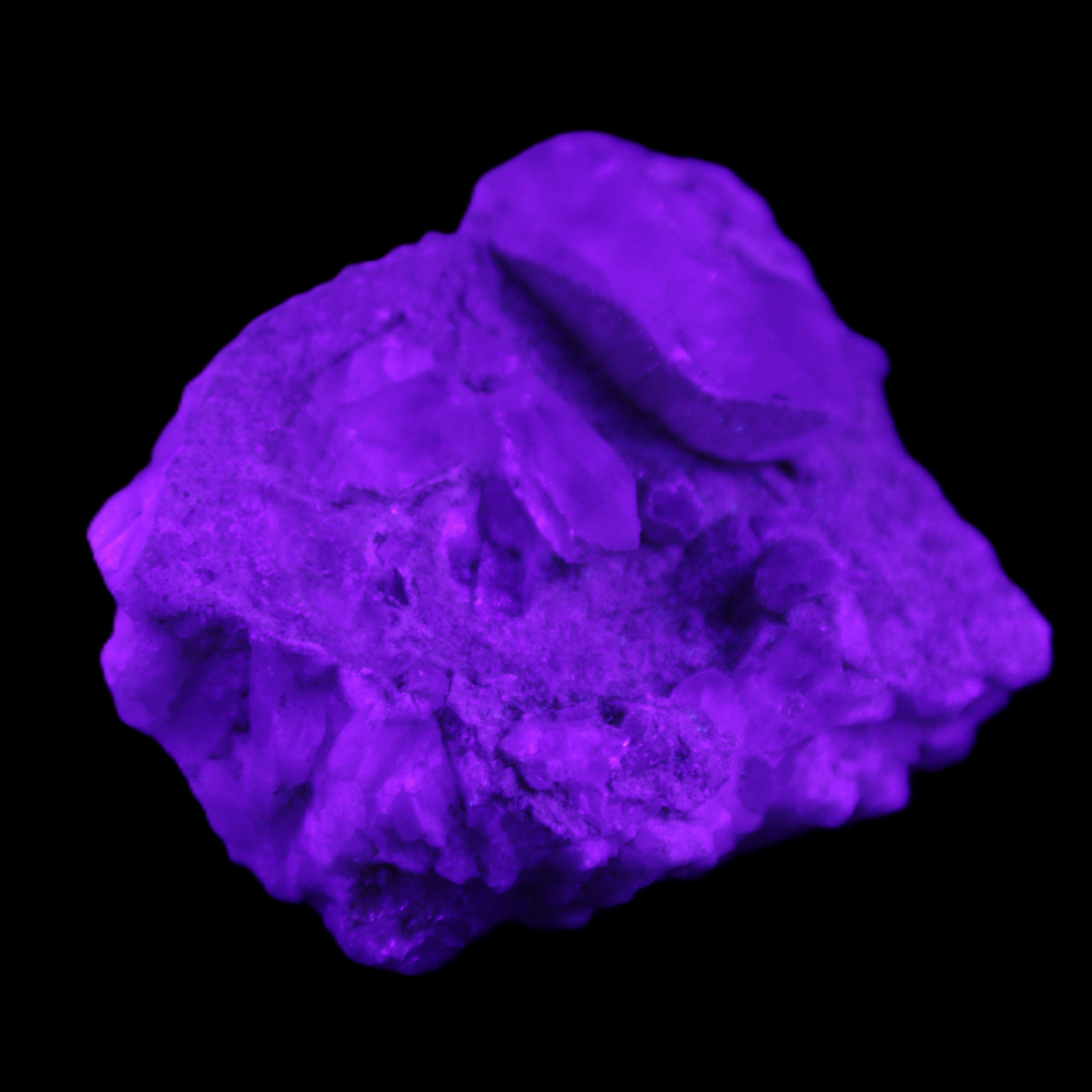 Quartz crystals in Feldspar matrix from Pakistan 313.8ct 62.8g in UV light - Rocks and Things Store