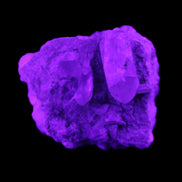 Quartz crystals in Feldspar matrix from Pakistan 313.8ct 62.8g in UV light - Rocks and Things Store