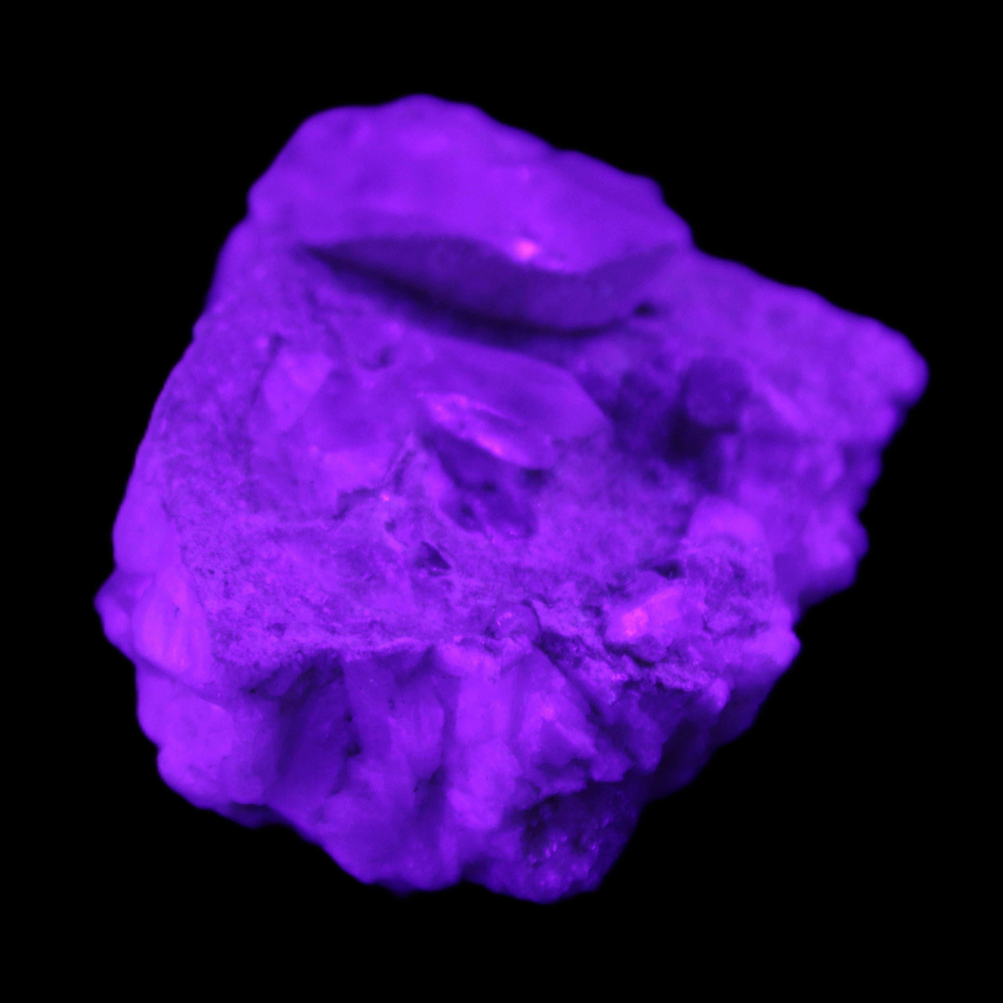 Quartz crystals in Feldspar matrix from Pakistan 313.8ct 62.8g in UV light - Rocks and Things Store