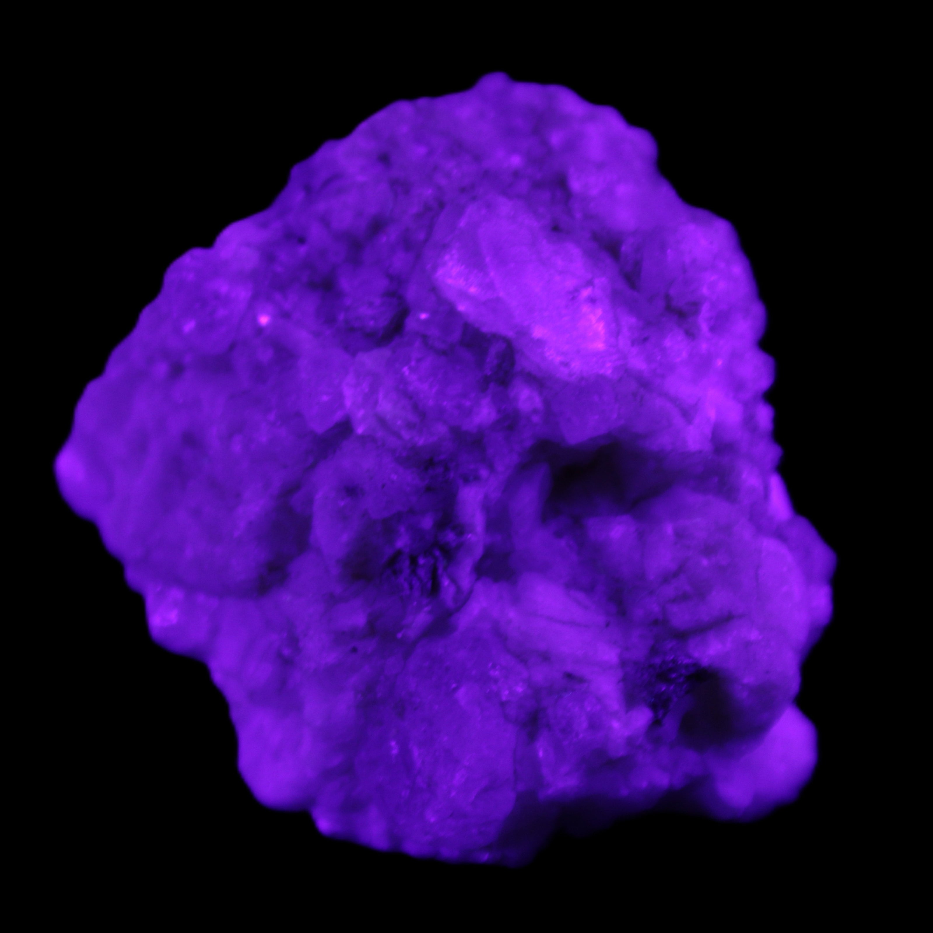 Quartz crystals in Feldspar matrix from Pakistan 313.8ct 62.8g in UV light - Rocks and Things Store