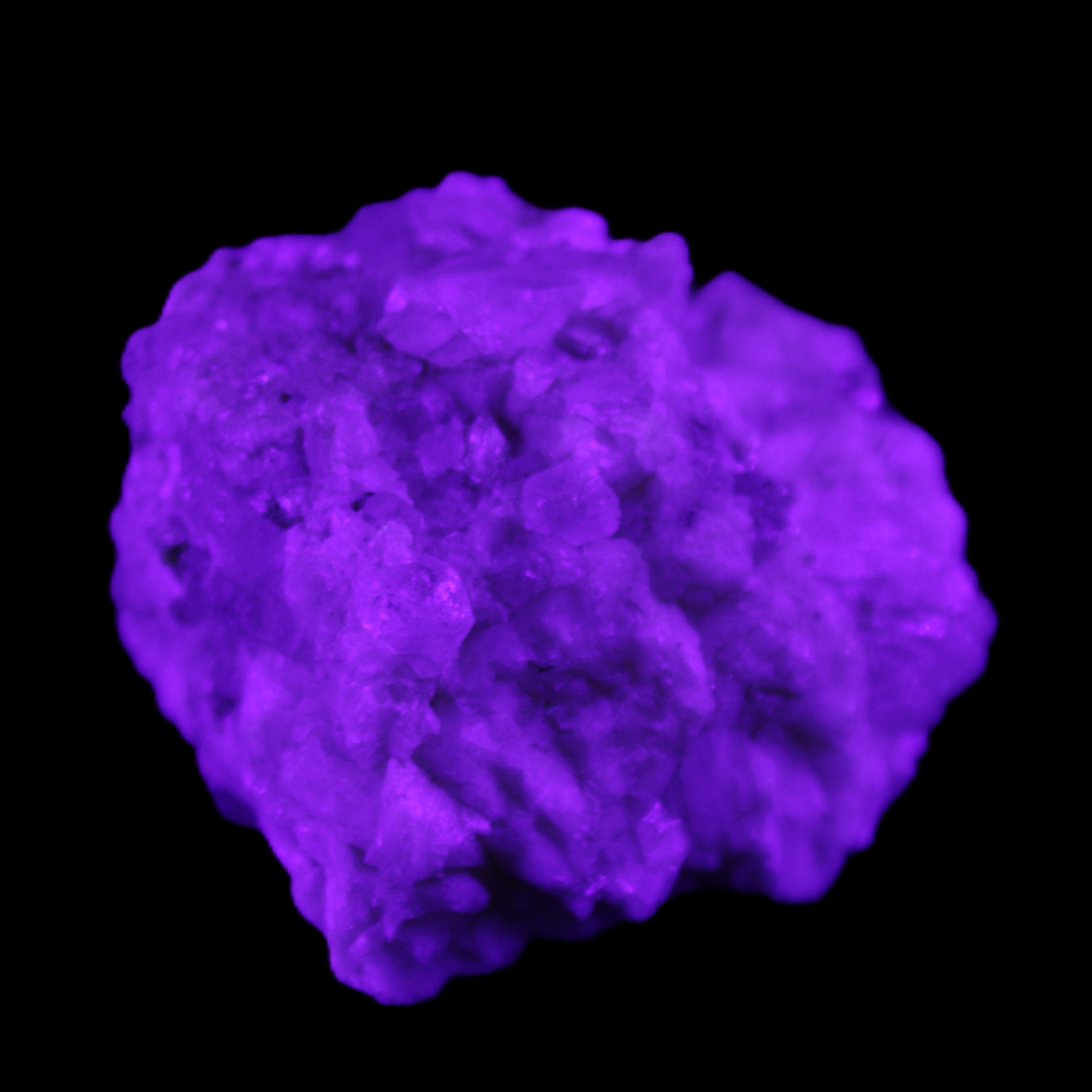 Quartz crystals in Feldspar matrix from Pakistan 313.8ct 62.8g in UV light - Rocks and Things Store