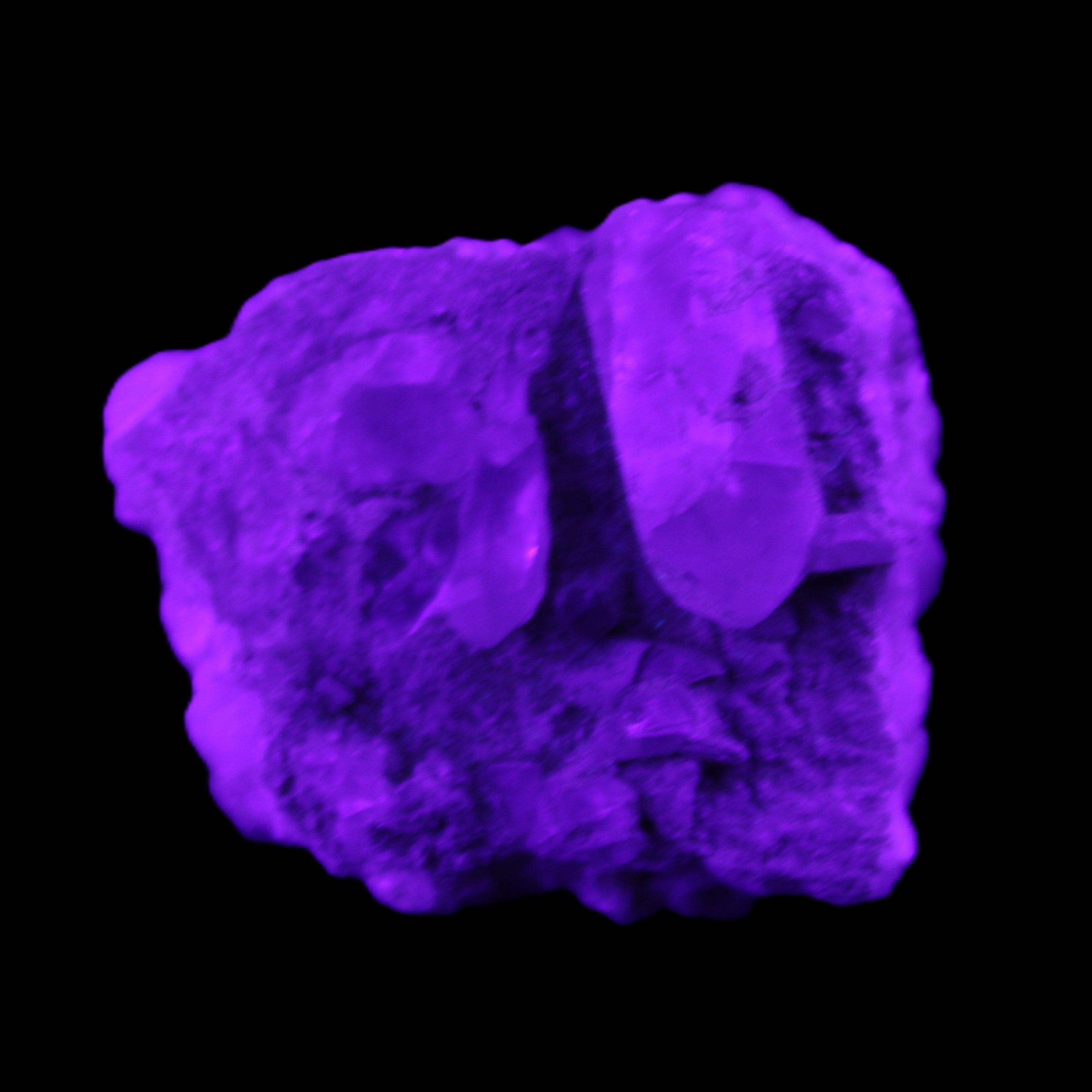 Quartz crystals in Feldspar matrix from Pakistan 313.8ct 62.8g in UV light - Rocks and Things Store