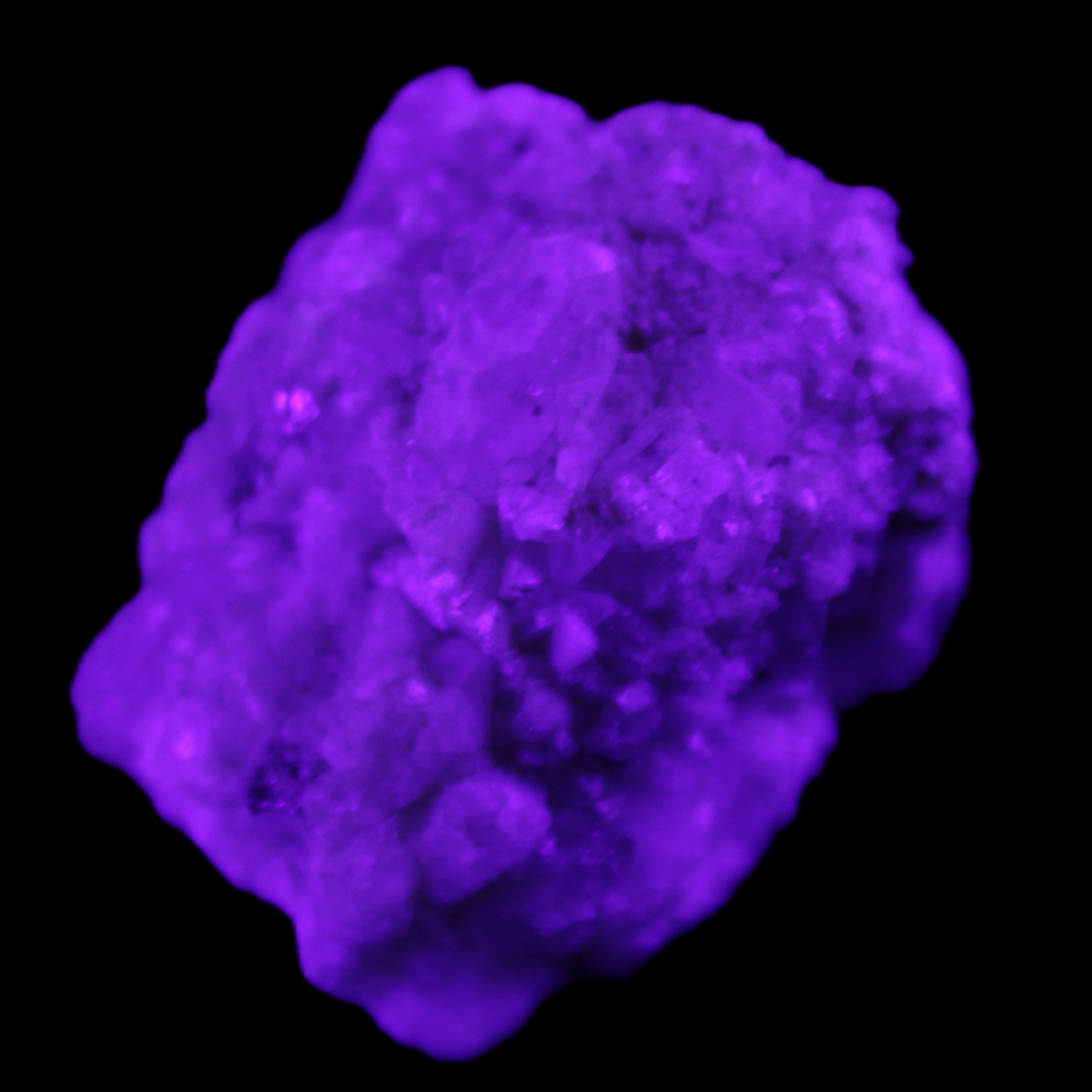 Quartz crystals in Feldspar matrix from Pakistan 313.8ct 62.8g in UV light - Rocks and Things Store