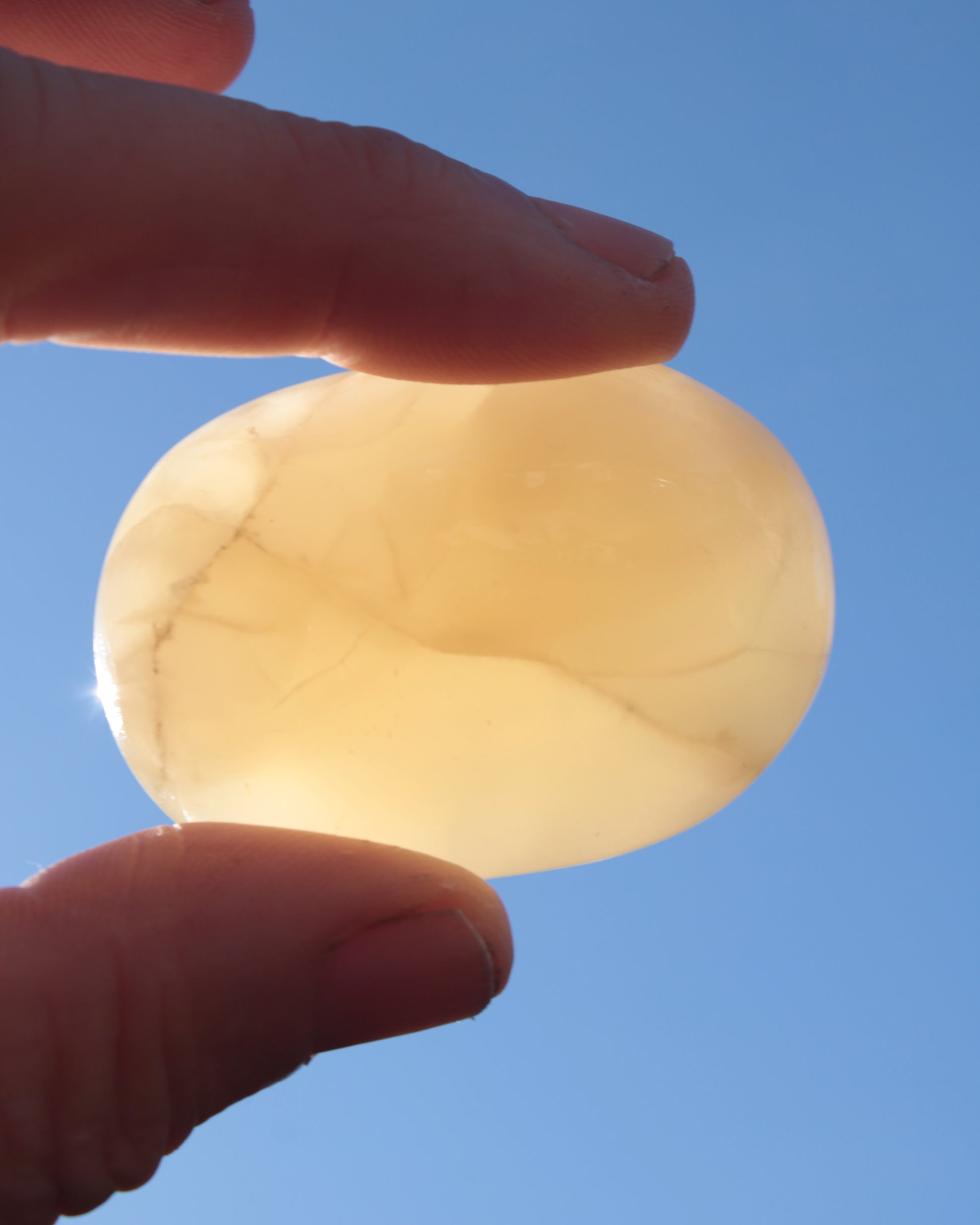 Honey Calcite palm stone from Pakistan 71.7g Rocks and Things