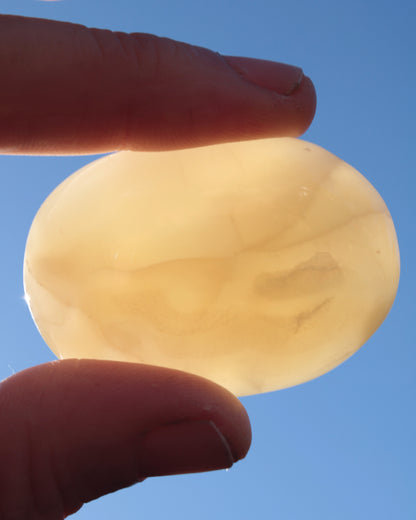 Honey Calcite palm stone from Pakistan 71.7g Rocks and Things