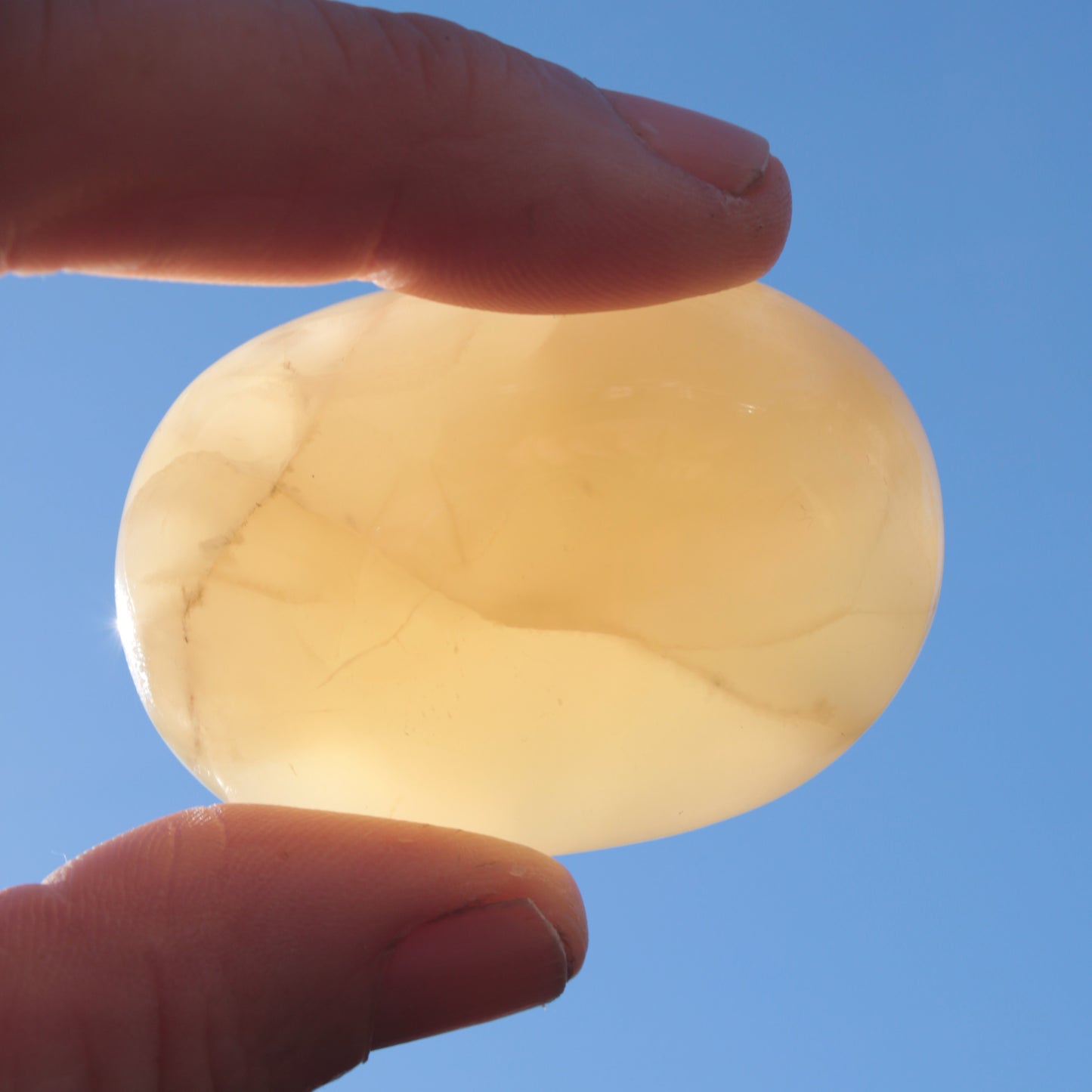 Honey Calcite palm stone from Pakistan 71.7g Rocks and Things