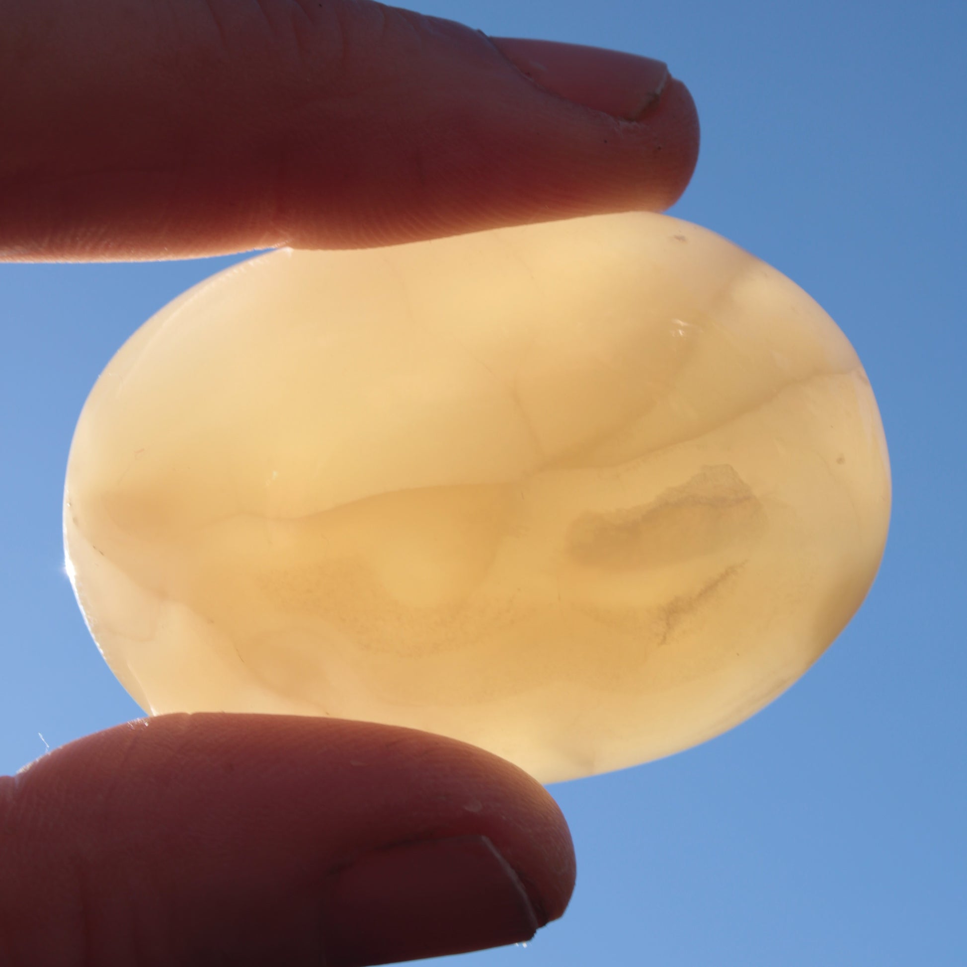 Honey Calcite palm stone from Pakistan 71.7g Rocks and Things