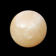 Honey Calcite sphere 174/176g in sunlight - Rocks and Things Store