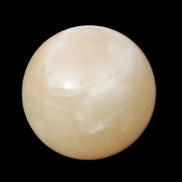 Honey Calcite sphere 174/176g in sunlight - Rocks and Things Store