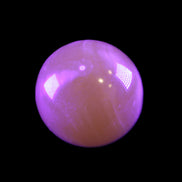 Honey Calcite sphere 174/176g in UV light - Rocks and Things Store