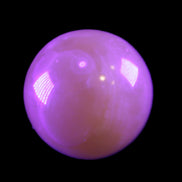 Honey Calcite sphere 174/176g in UV light - Rocks and Things Store