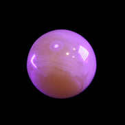 Honey Calcite sphere 174/176g in UV light - Rocks and Things Store
