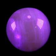 Honey Calcite sphere 176g in UV light - Rocks and Things Store