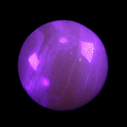 Honey Calcite sphere 176g in UV light - Rocks and Things Store