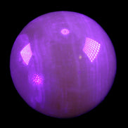 Honey Calcite sphere 176g in UV light - Rocks and Things Store