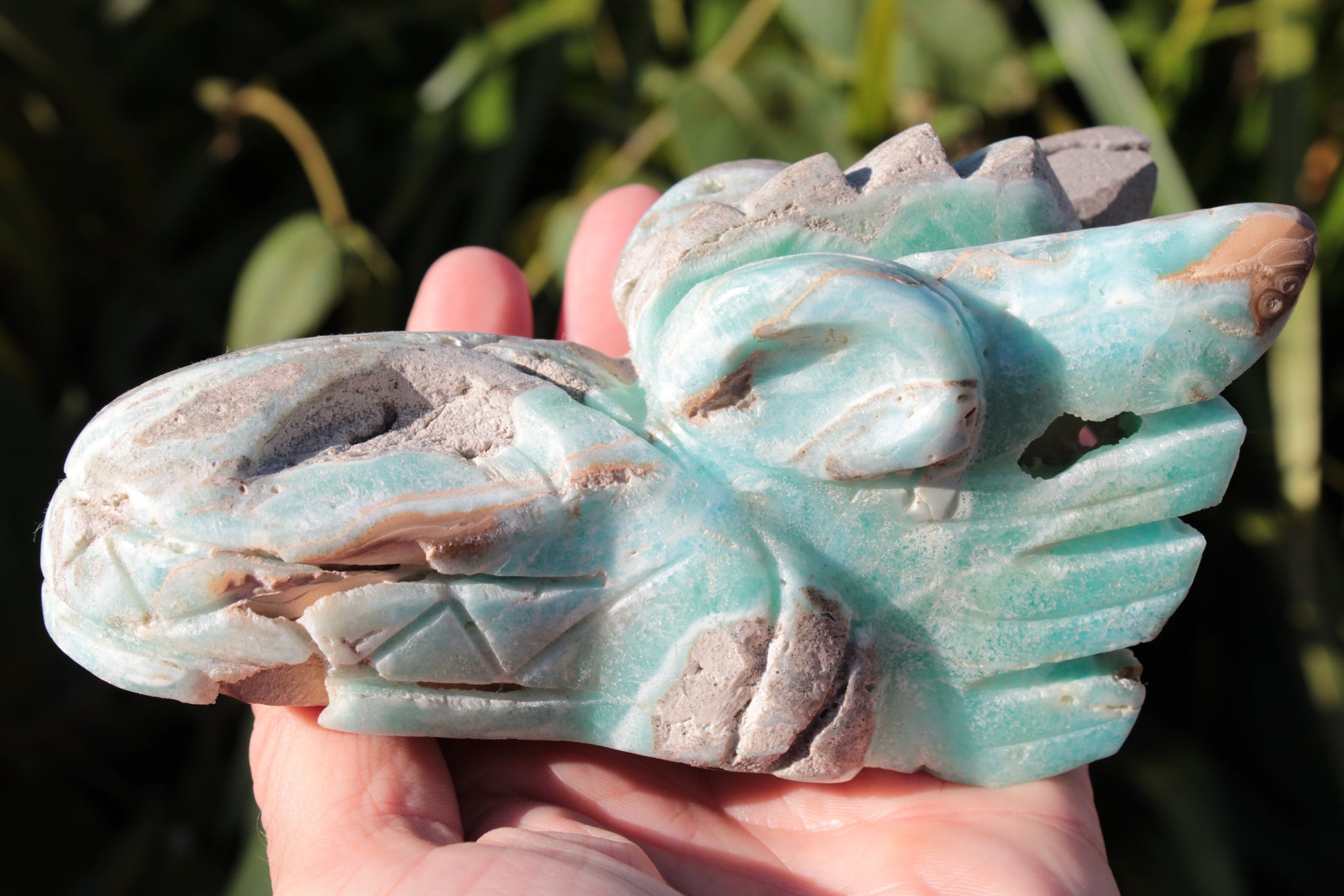 Caribbean Calcite hand-carved dragon's head 675g Rocks and Things