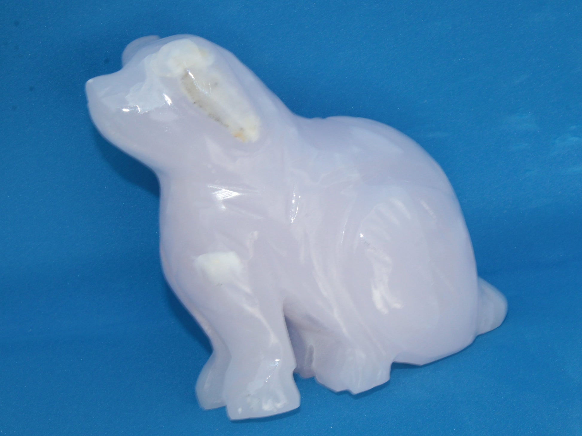 Mangano Calcite hand-carved sitting dog 604g Rocks and Things