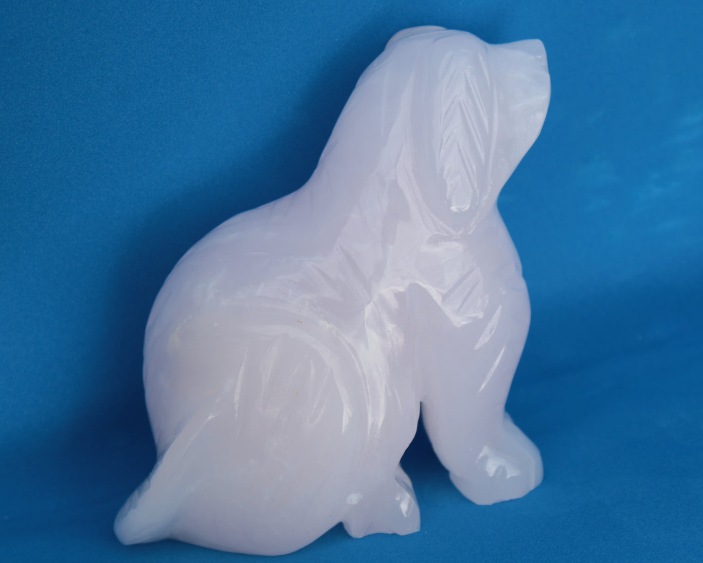 Mangano Calcite hand-carved sitting dog 604g Rocks and Things