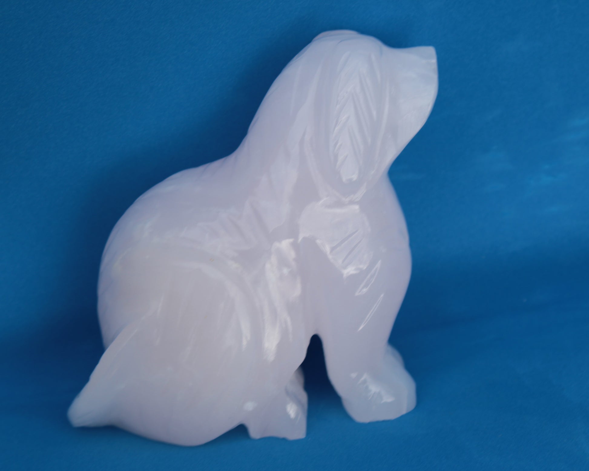 Mangano Calcite hand-carved sitting dog 604g Rocks and Things