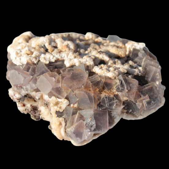 Cubic Fluorite cluster with UV reactive Calcite 278g in sunshine - Rocks and Things Store