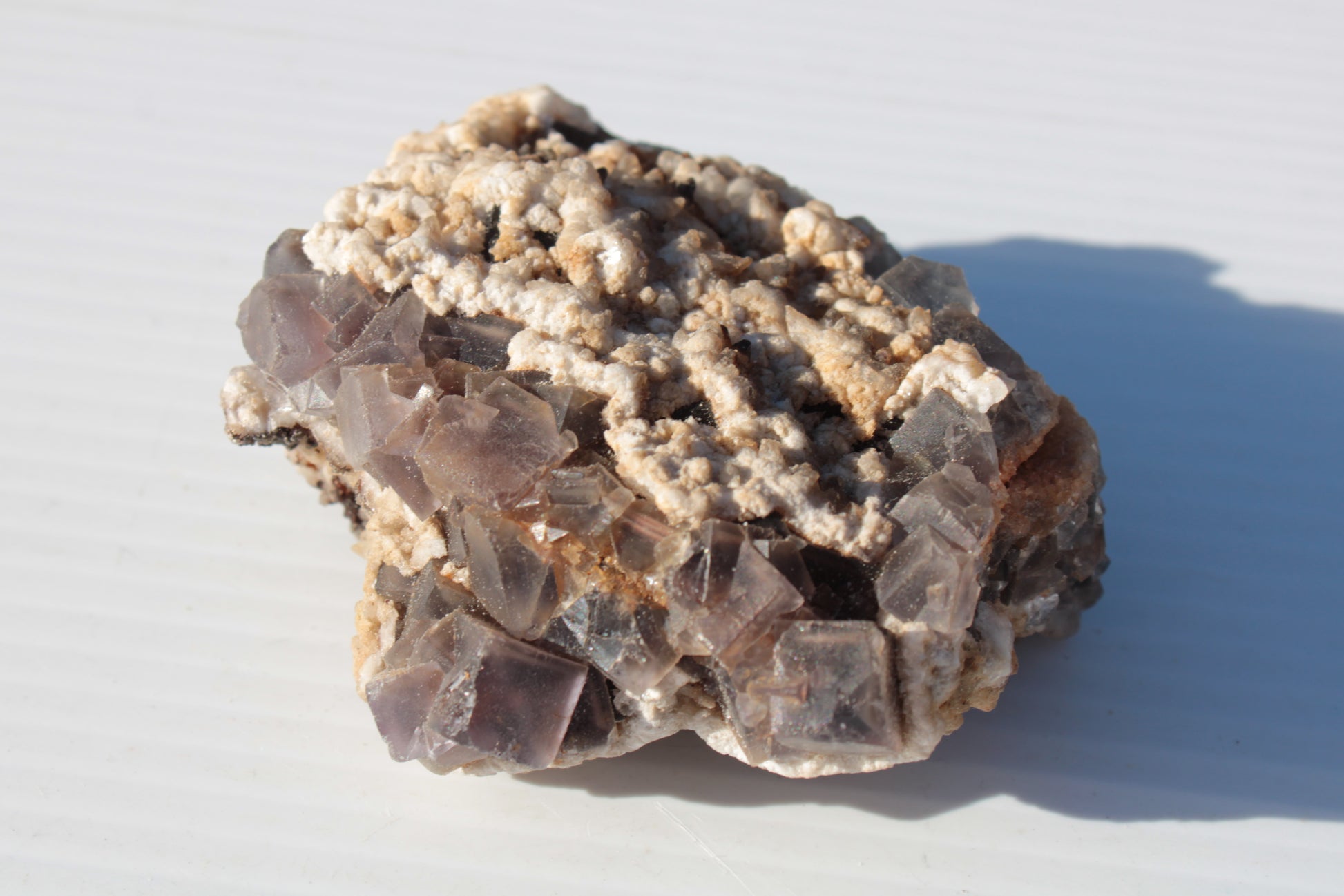 Cubic Fluorite cluster with UV reactive Calcite 278g Rocks and Things