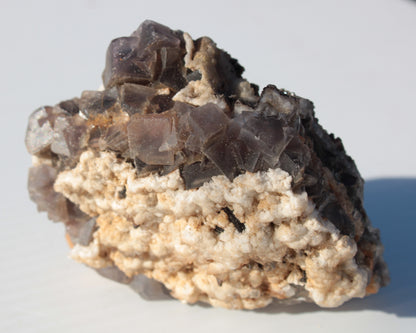 Cubic Fluorite cluster with UV reactive Calcite 278g Rocks and Things