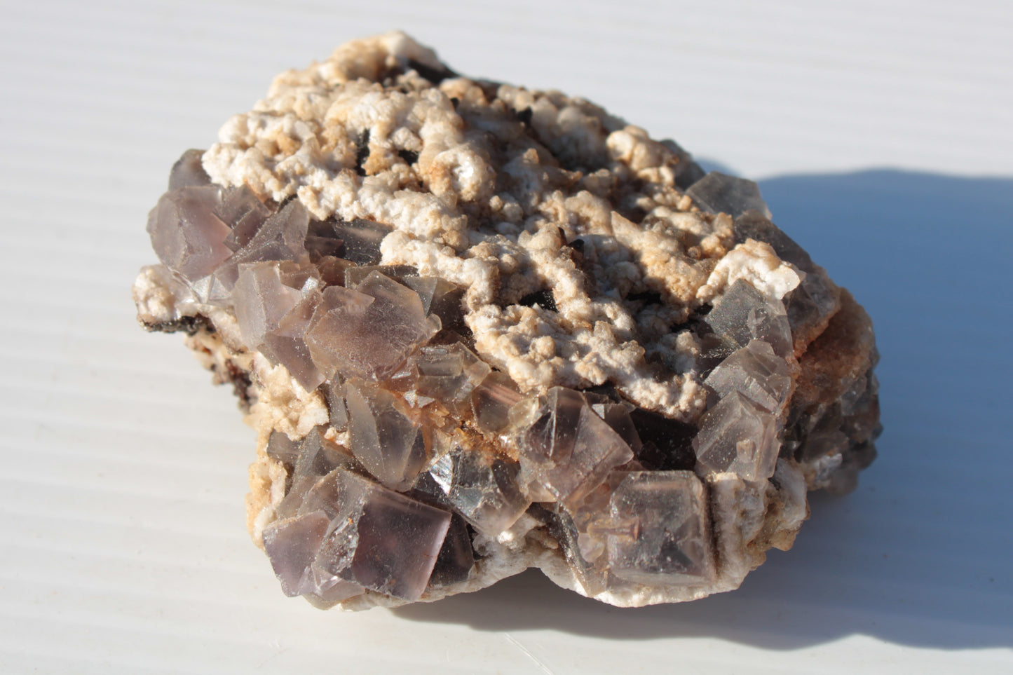 Cubic Fluorite cluster with UV reactive Calcite 278g Rocks and Things