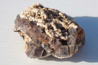 Cubic Fluorite cluster with UV reactive Calcite 278g Rocks and Things