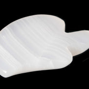 Mangano Calcite hand-carved bitten apple 80g Rocks and Things