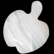 Mangano Calcite hand-carved apple 50-59g in sunlight - Rocks and Things Store