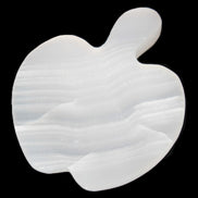 Mangano Calcite hand-carved apple 50-59g in sunlight - Rocks and Things Store