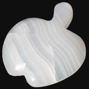 Mangano Calcite hand-carved apple 50-59g in sunlight - Rocks and Things Store