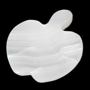 Mangano Calcite hand-carved apple 50-59g in sunlight - Rocks and Things Store