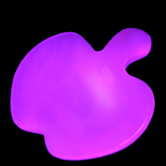 Mangano Calcite hand-carved apple 41-49g in UV light - Rocks and Things Store