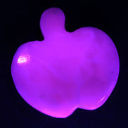 Mangano Calcite hand-carved apple 41-49g in UV light - Rocks and Things Store