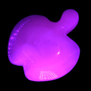 Mangano Calcite hand-carved apple 41-49g in UV light - Rocks and Things Store