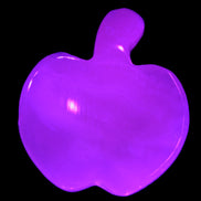 Mangano Calcite hand-carved apple 41-49g in UV light - Rocks and Things Store
