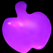 Mangano Calcite hand-carved apple 41-49g in UV light - Rocks and Things Store