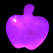 Mangano Calcite hand-carved apple 41-49g in UV light - Rocks and Things Store