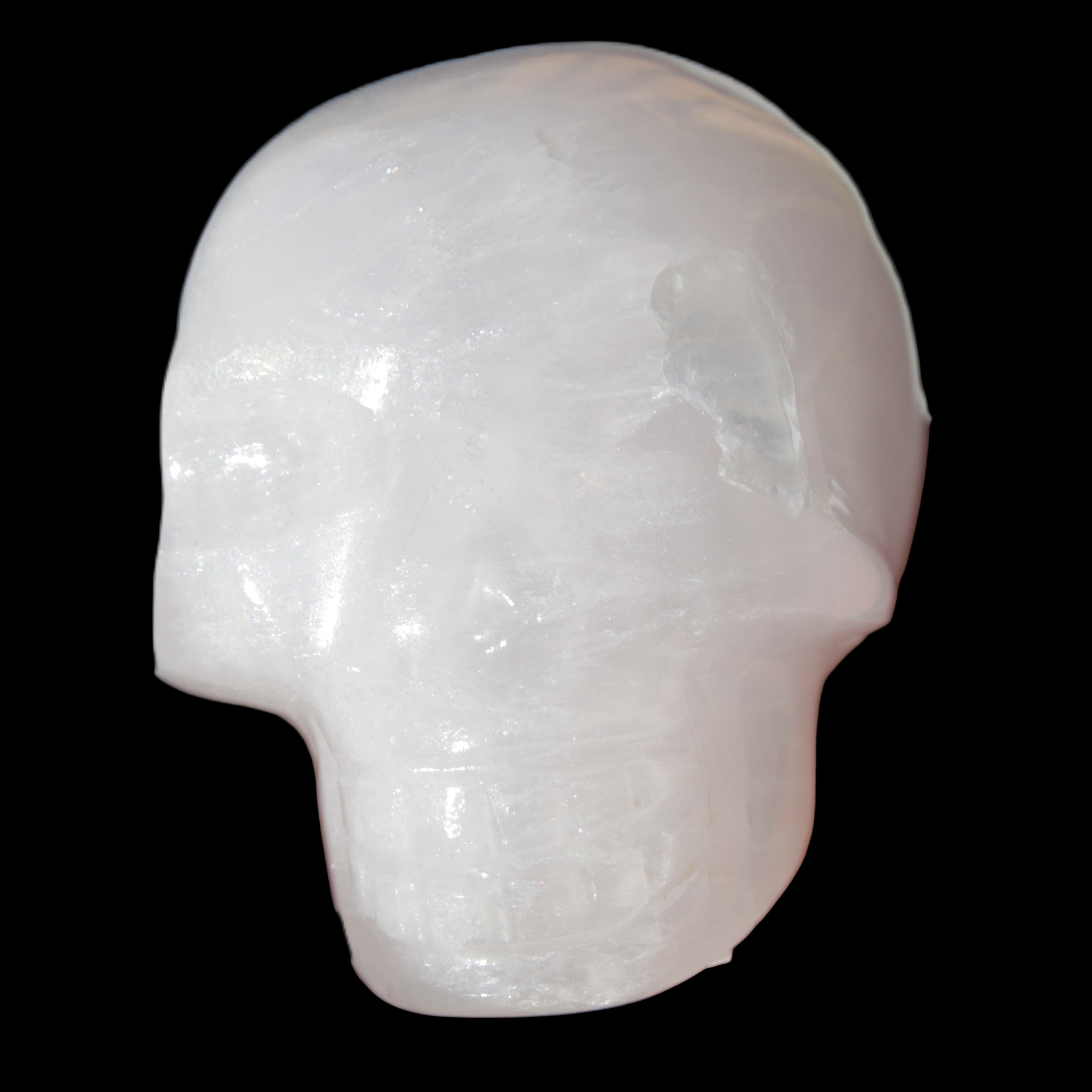 Mangano Calcite skull 40*55*45mm  160/161g in sunlight - Rocks and Things Store