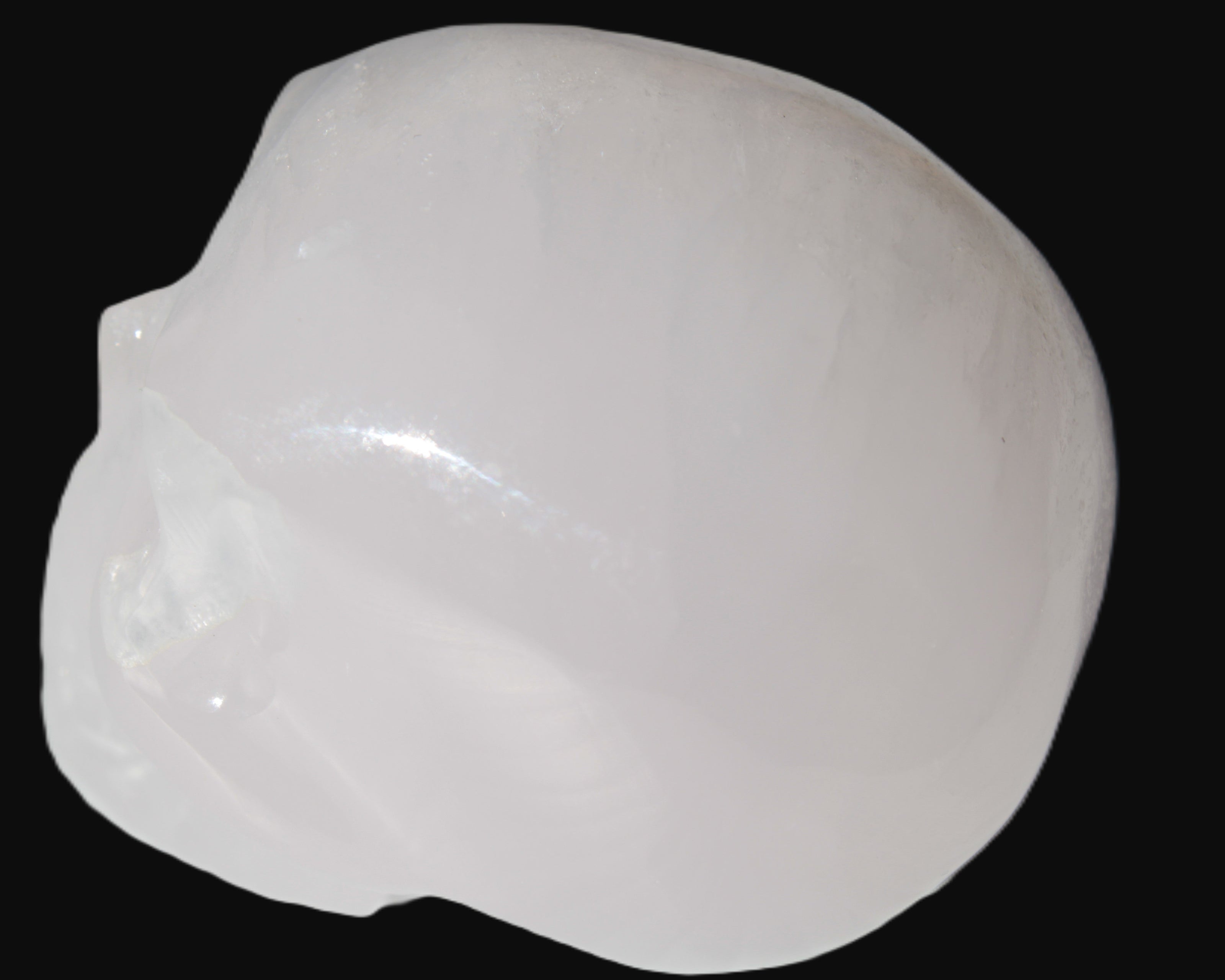 Mangano Calcite skull 40*55*45mm  160/161g in sunlight - Rocks and Things Store