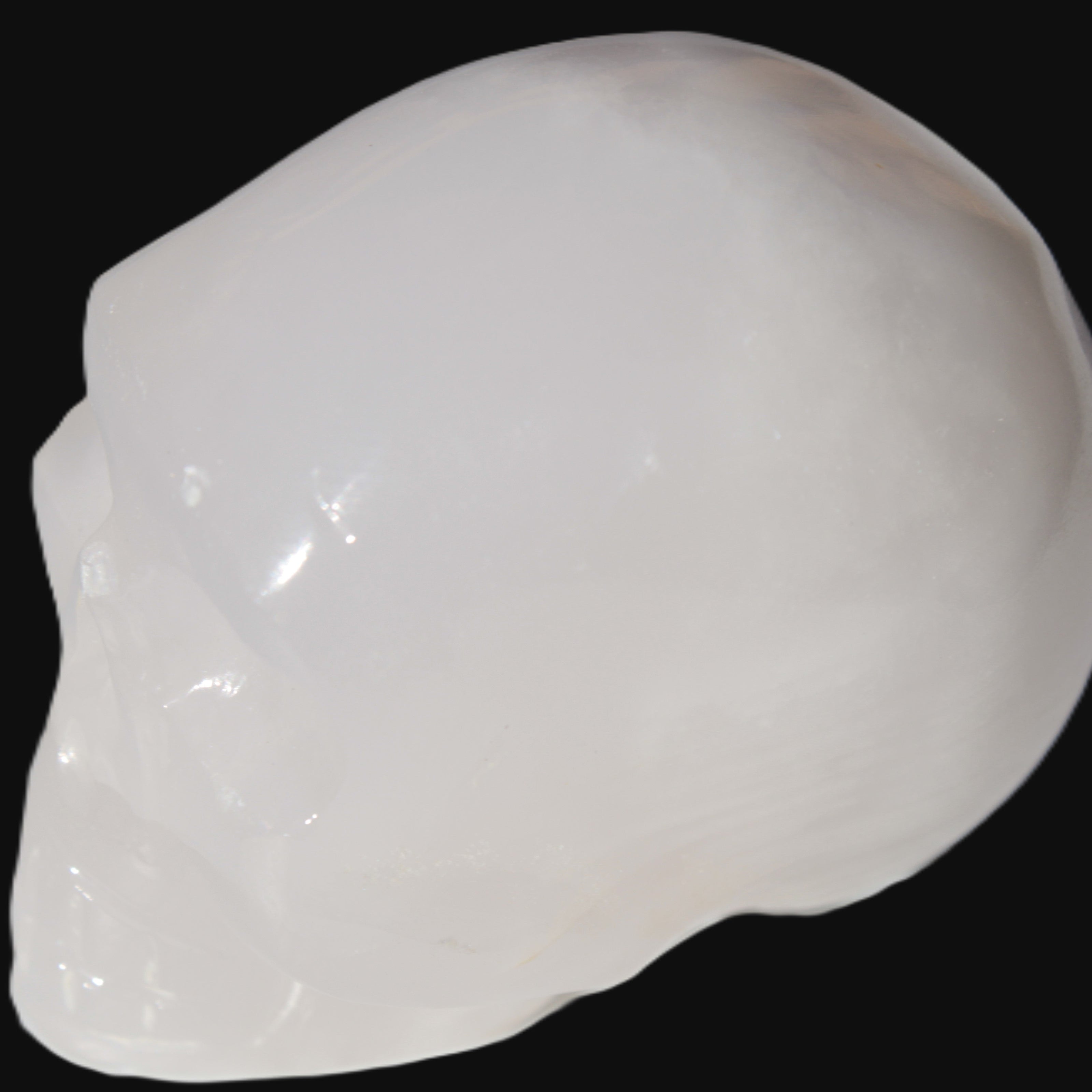 Mangano Calcite skull 40*55*45mm  160/161g in sunlight - Rocks and Things Store