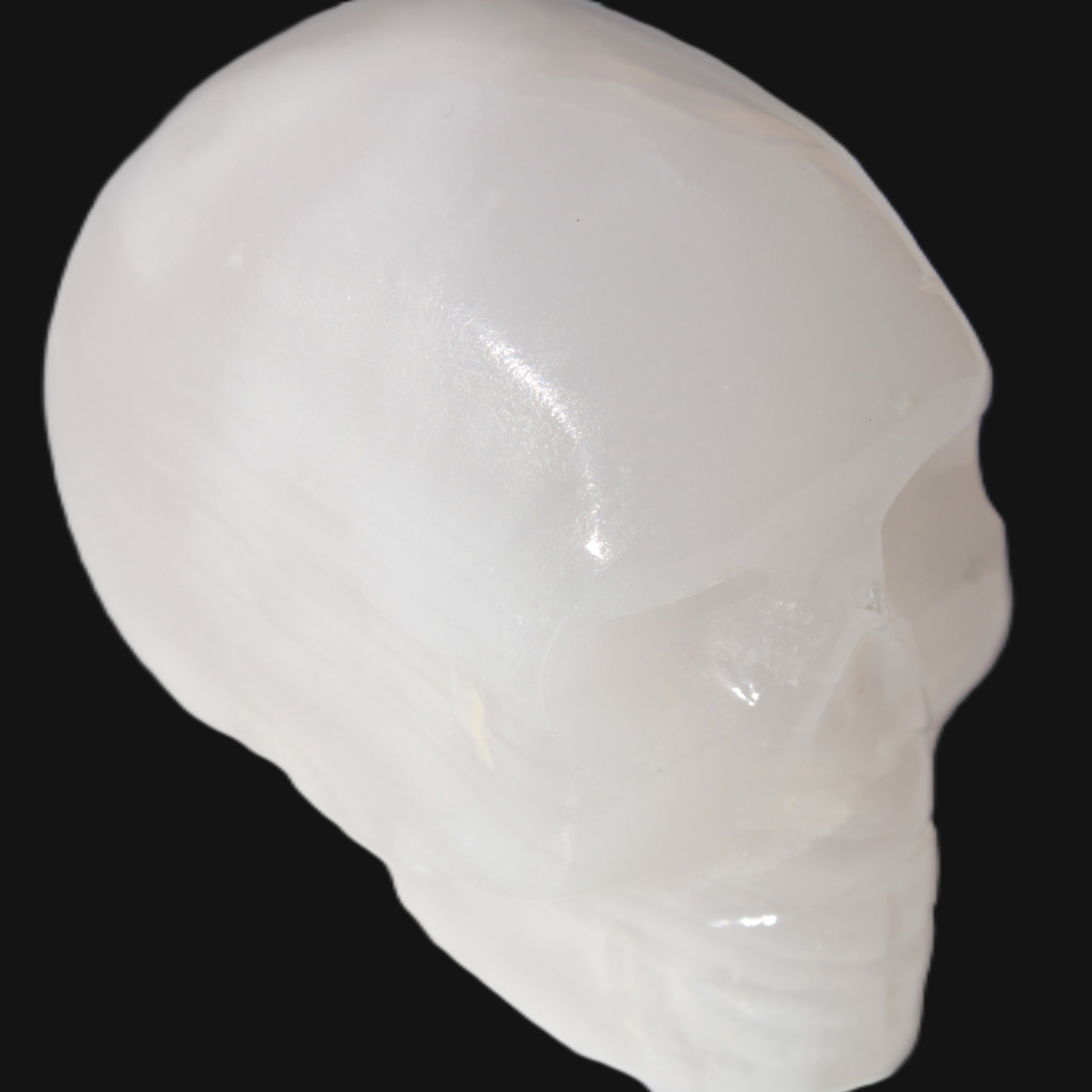 Mangano Calcite skull 40*55*45mm  160/161g in sunlight - Rocks and Things Store